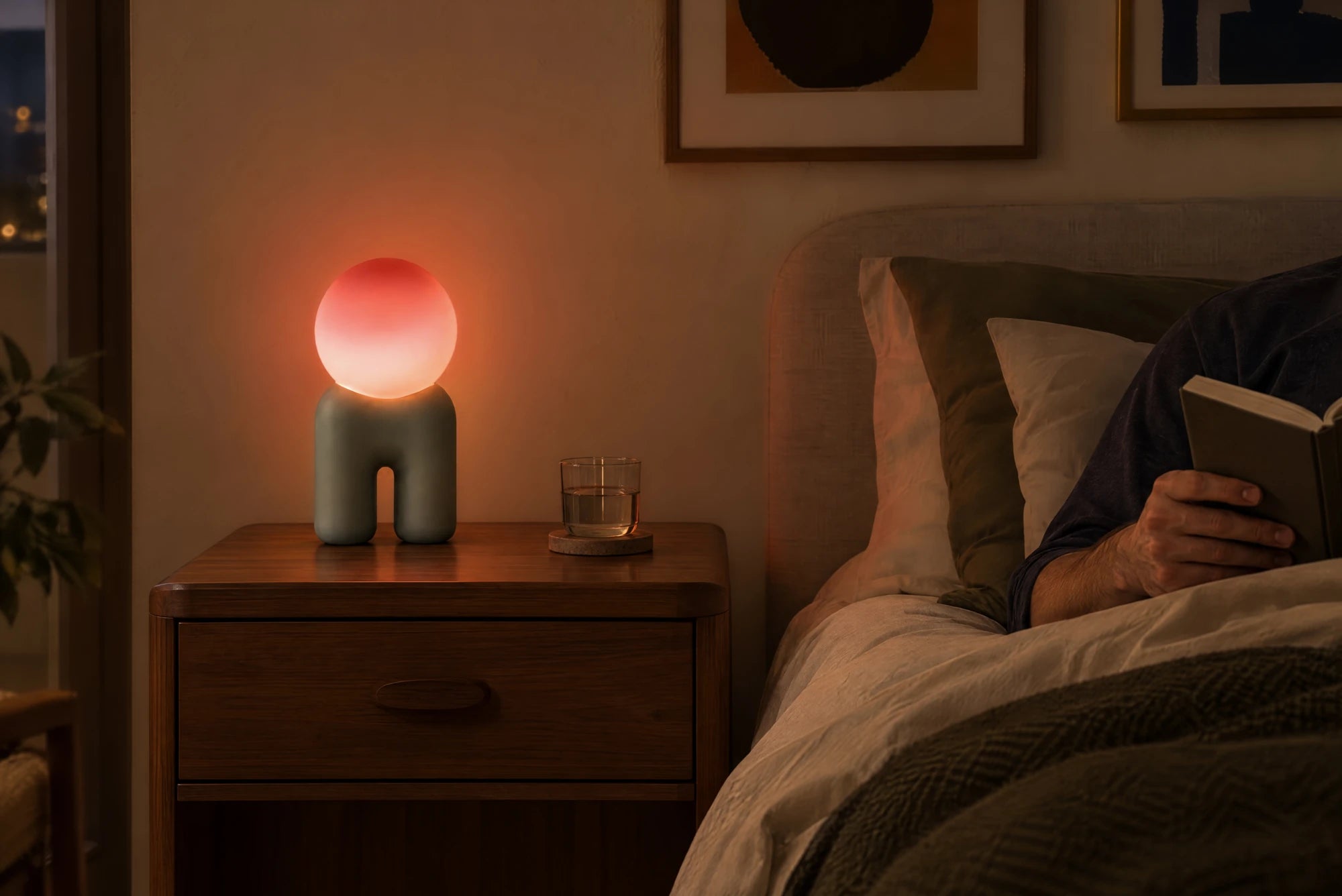 Buddy glowing by a bed